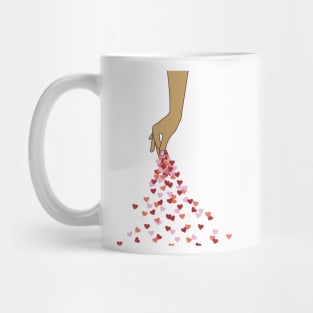 Hand sprinkling red and pink hearts, spread a hopefull message of love and care for each other! Warming Mug